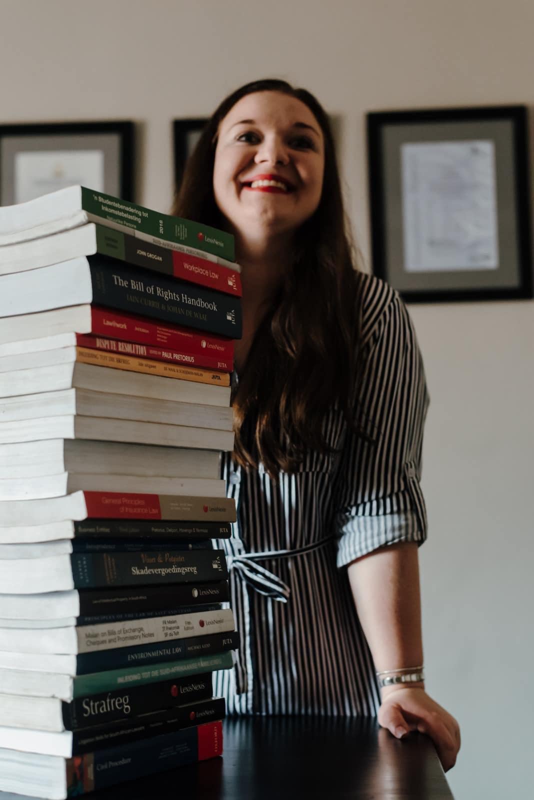 Anel Krog with law books